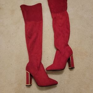 Red tall boots with gold heel
